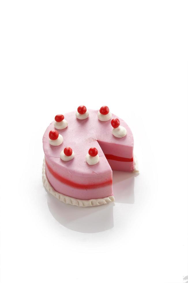 Small cake model from clay on white background photo