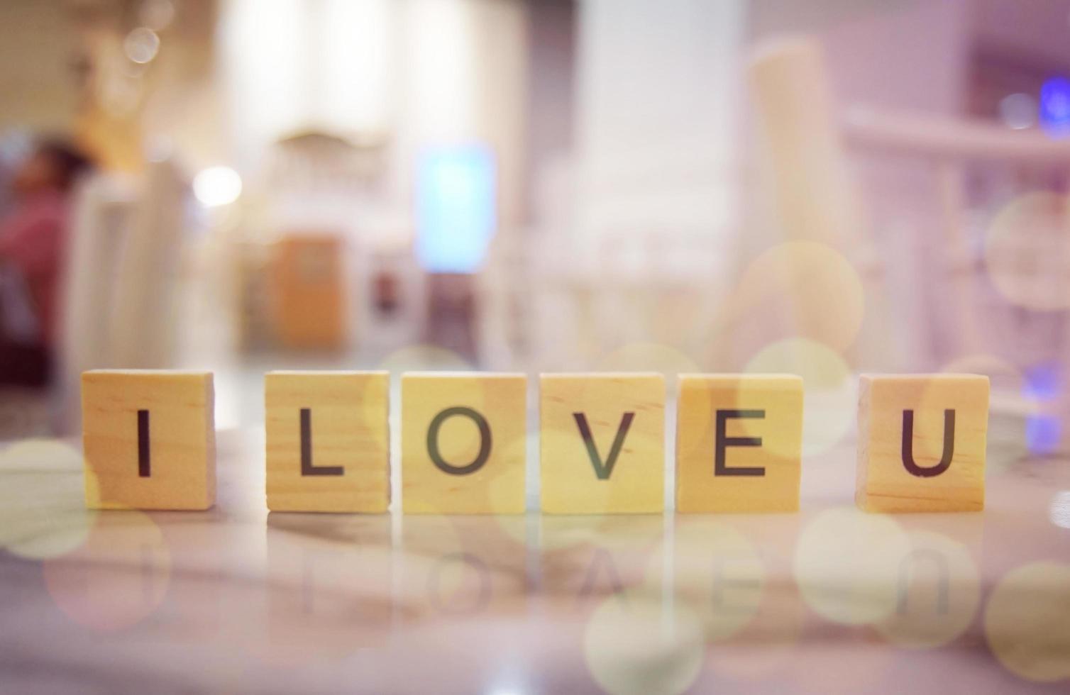 Wood block LOVE word on wooden table for background. copy Space photo