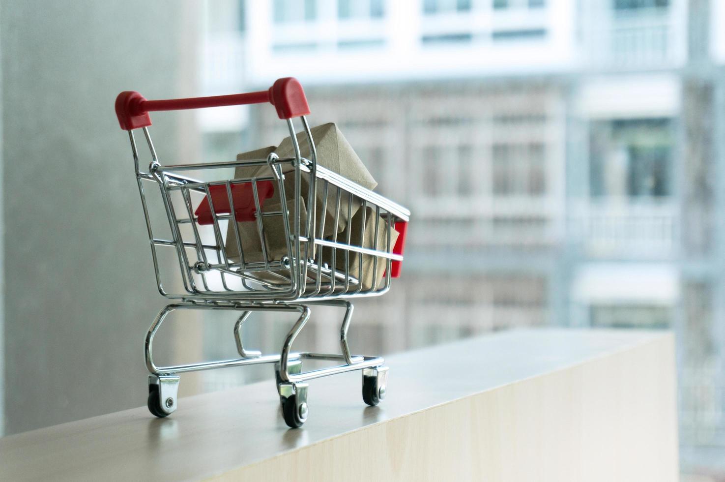 Shopping cart full of cardboard Paper boxes photo