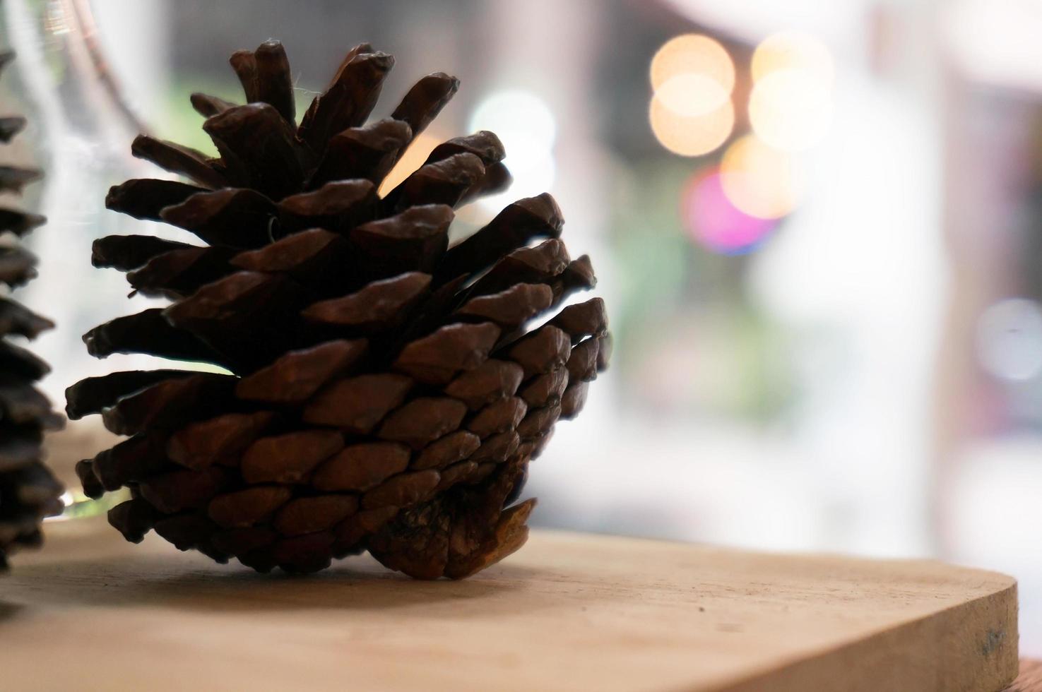 Pine cones on wooden table. photo