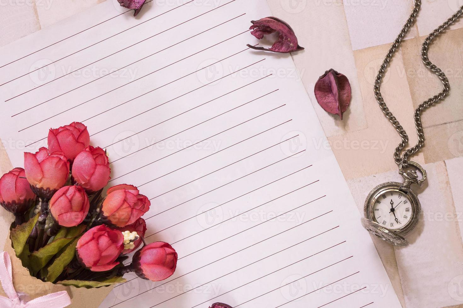 Paper with flowers and a pocket watch photo