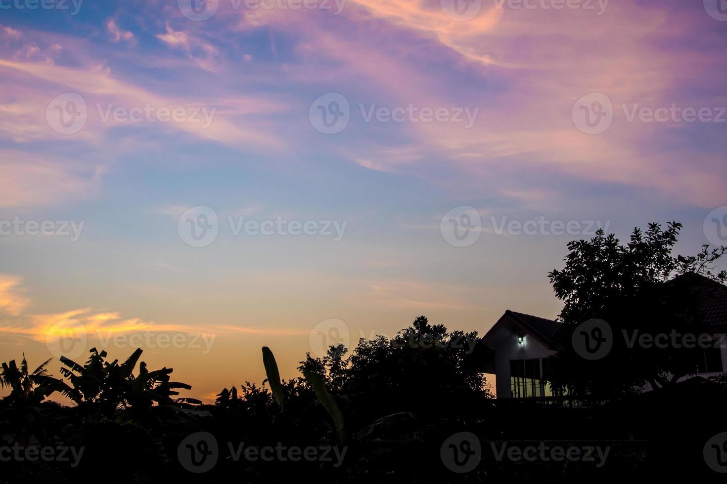 Silhouette of house and tree in the morning photo