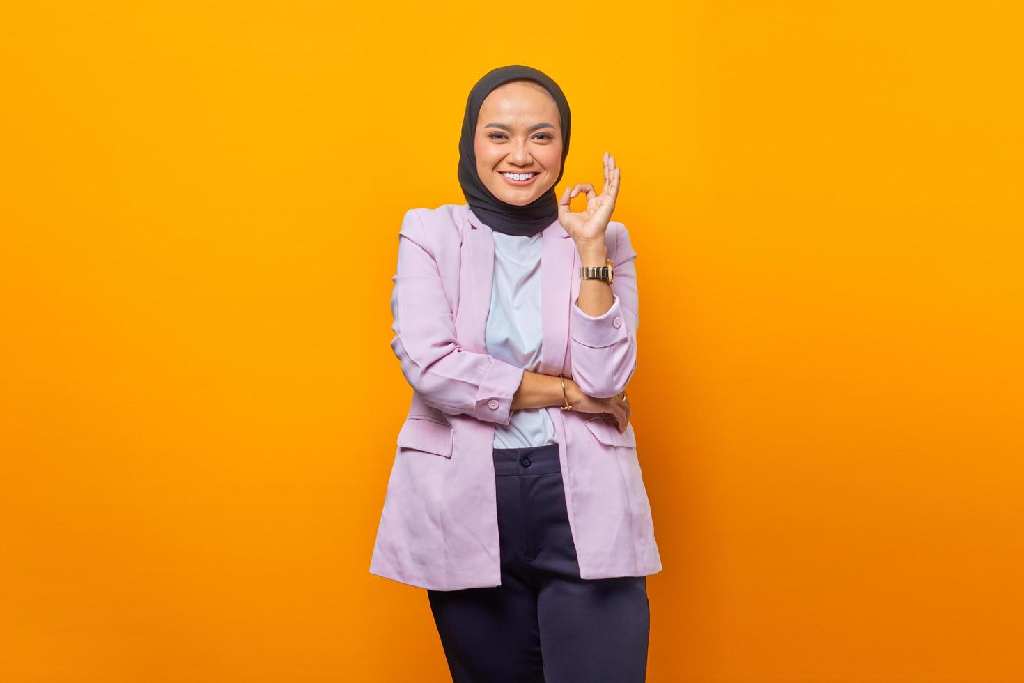 Happy Asian business woman showing ok sign photo