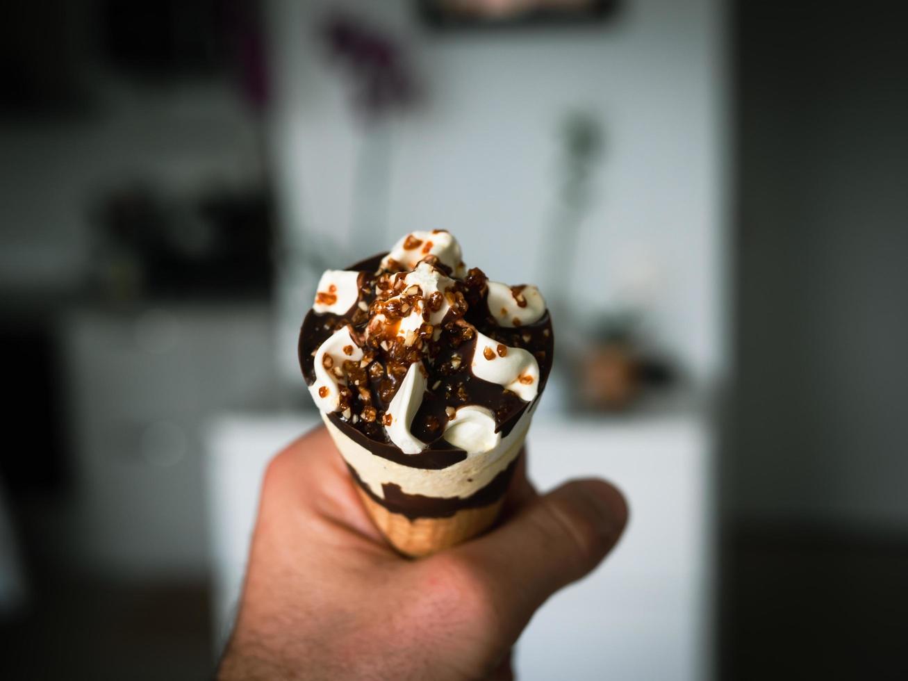 Chocolate ice cream with nuts in a waffle, photo close up details