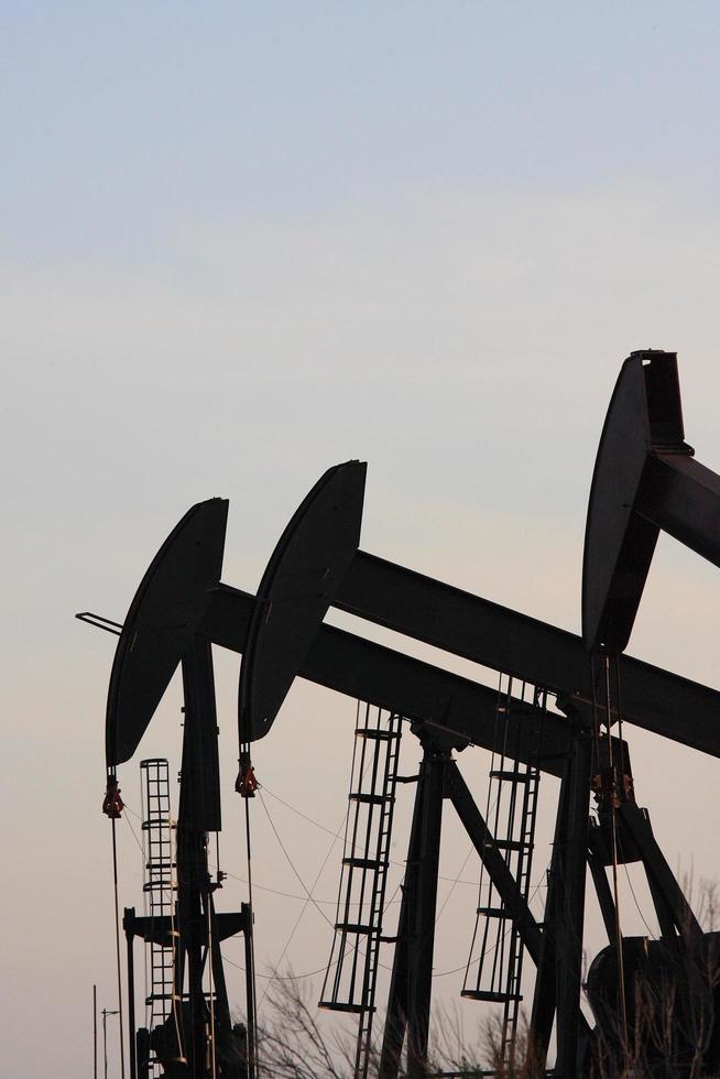 Oil rigs lined up in Los Angeles, USA photo