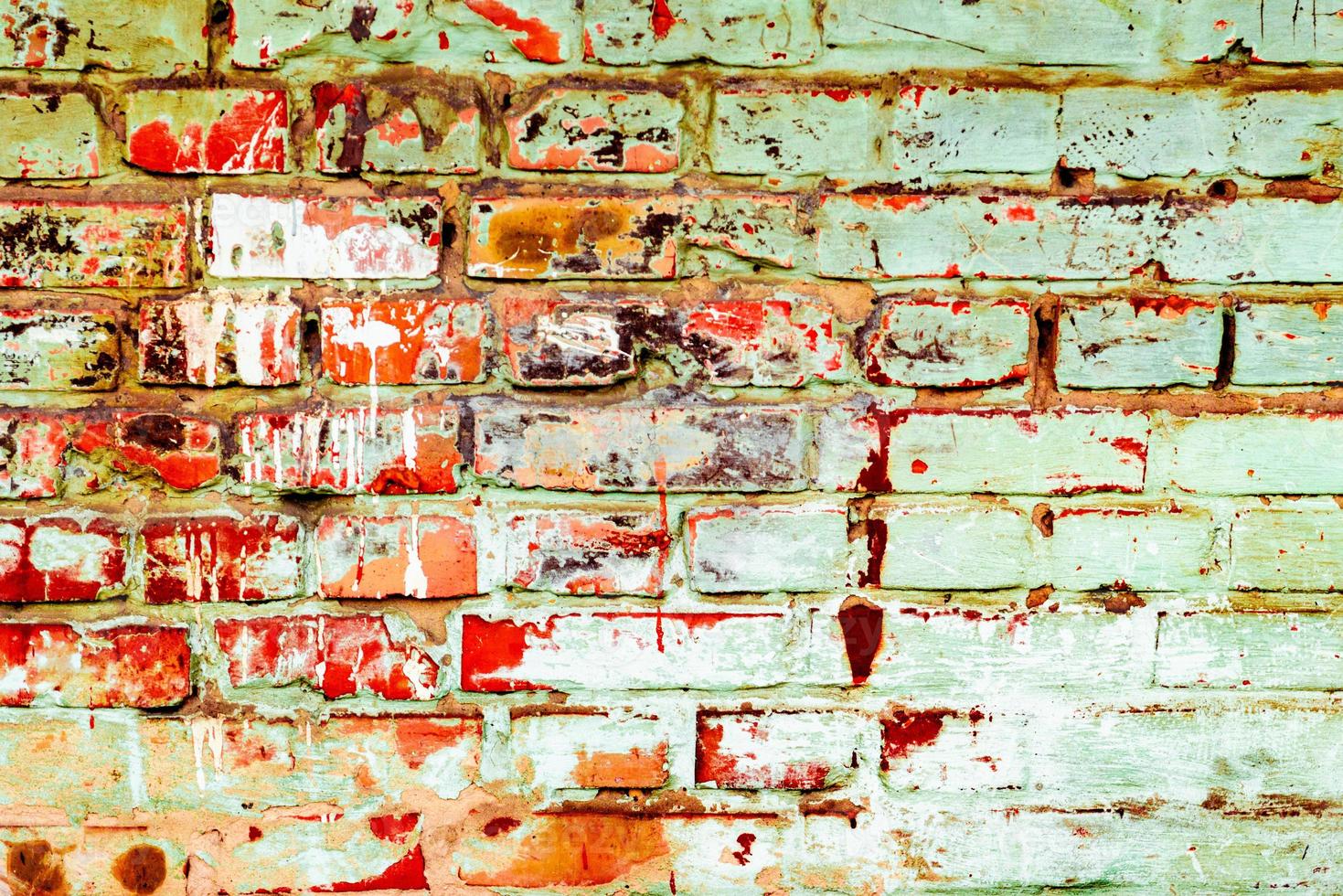 Texture of a brick wall with cracks and scratches photo