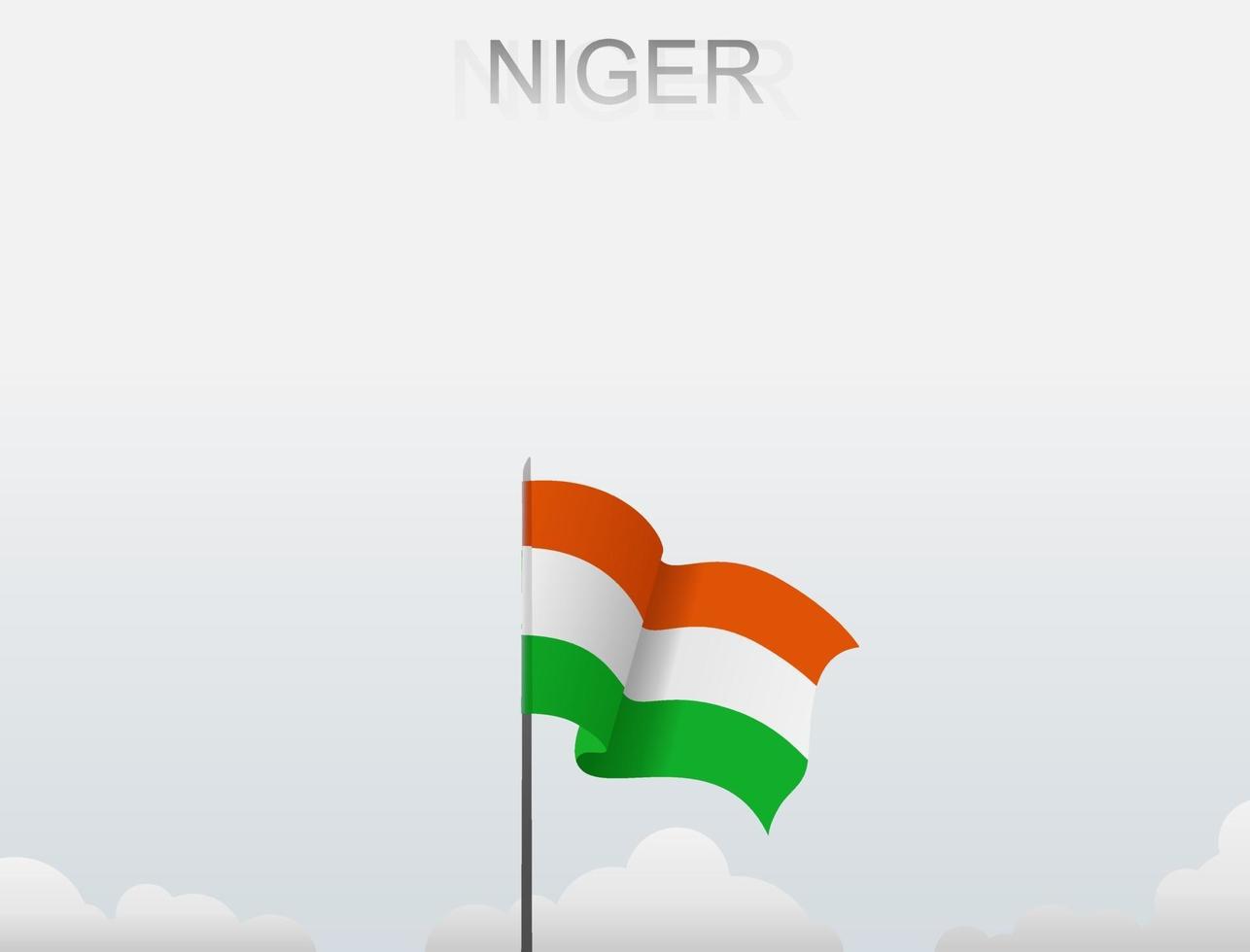 Flag of Niger flying under the white sky vector