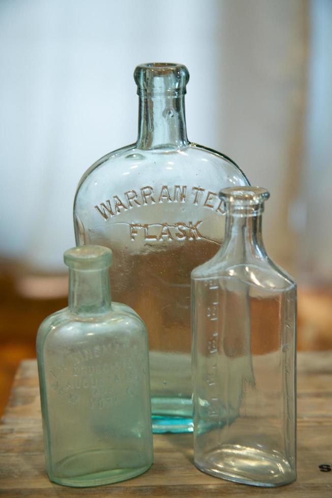 Three very old glass flasks photo