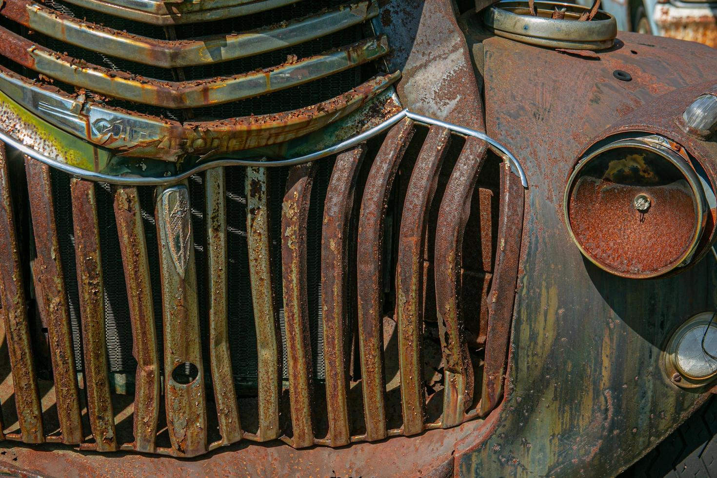 Grill of old rusty truck photo