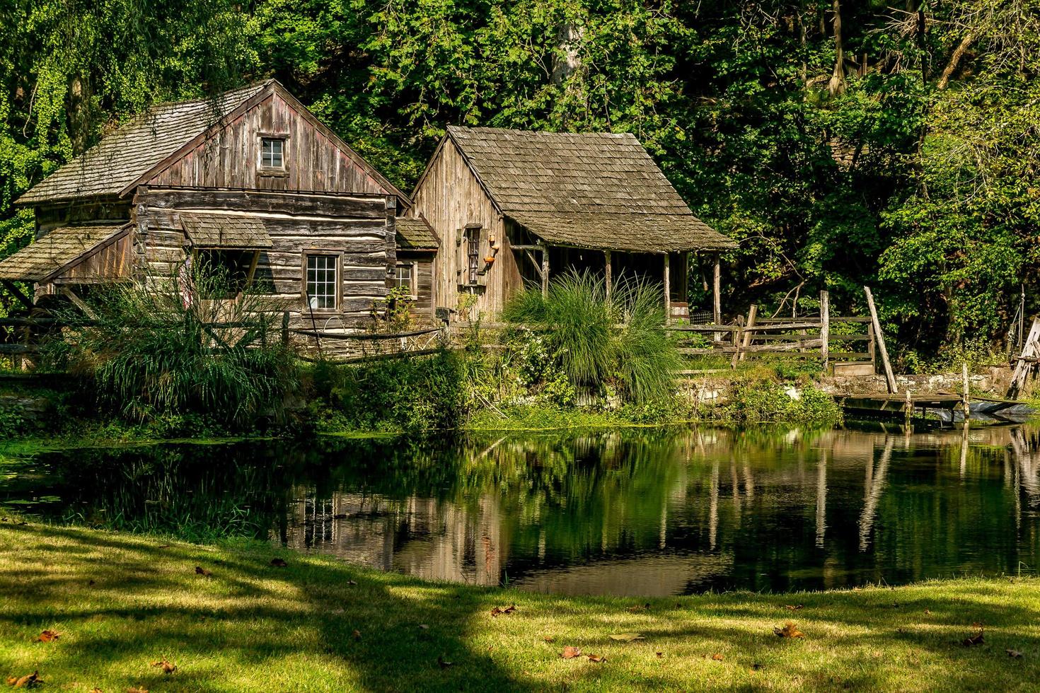 Old Mill Next to a Pond photo