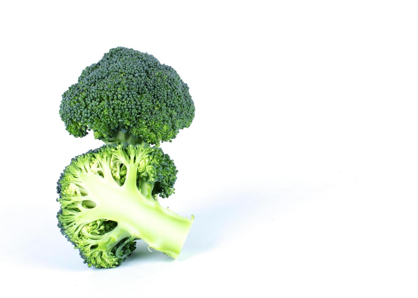 Broccoli vegetale sliced on white backgrounds photo