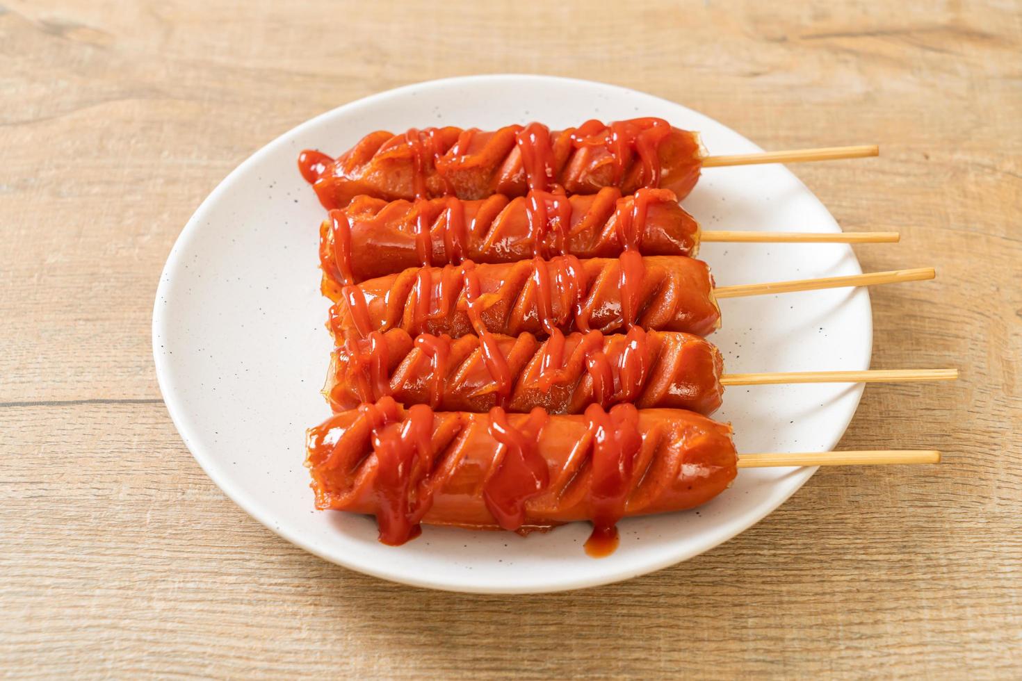 Fried sausage skewer with ketchup photo