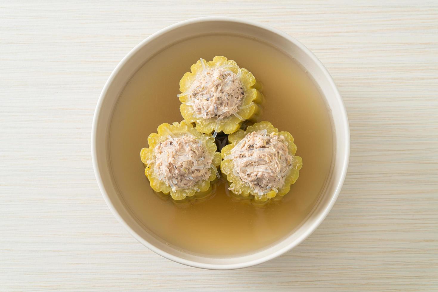 Stuffed bitter gourd with seasoned minced pork soup photo