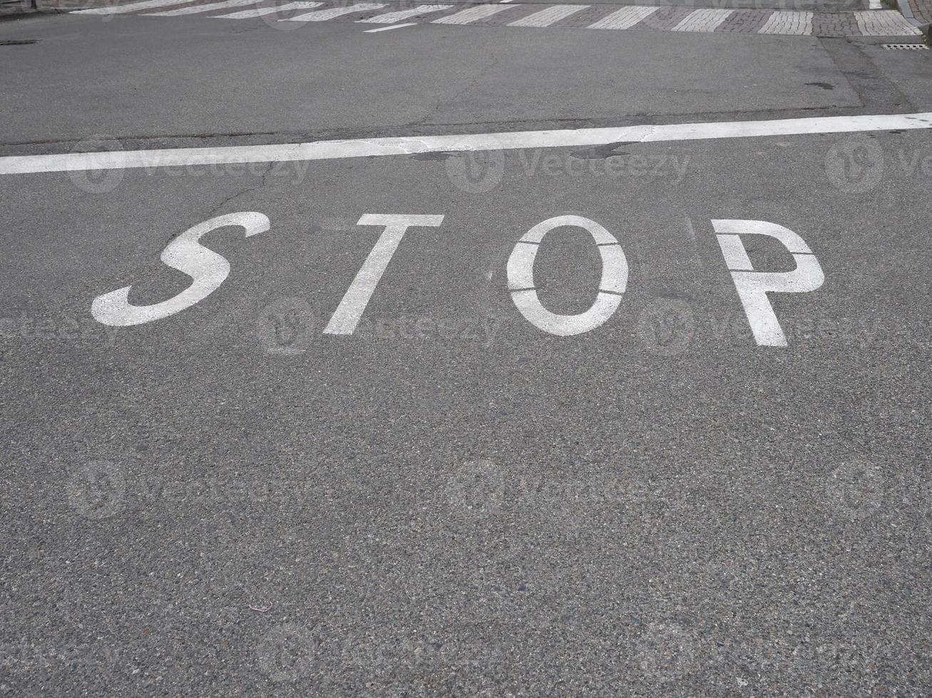 Stop sign on tarmac photo