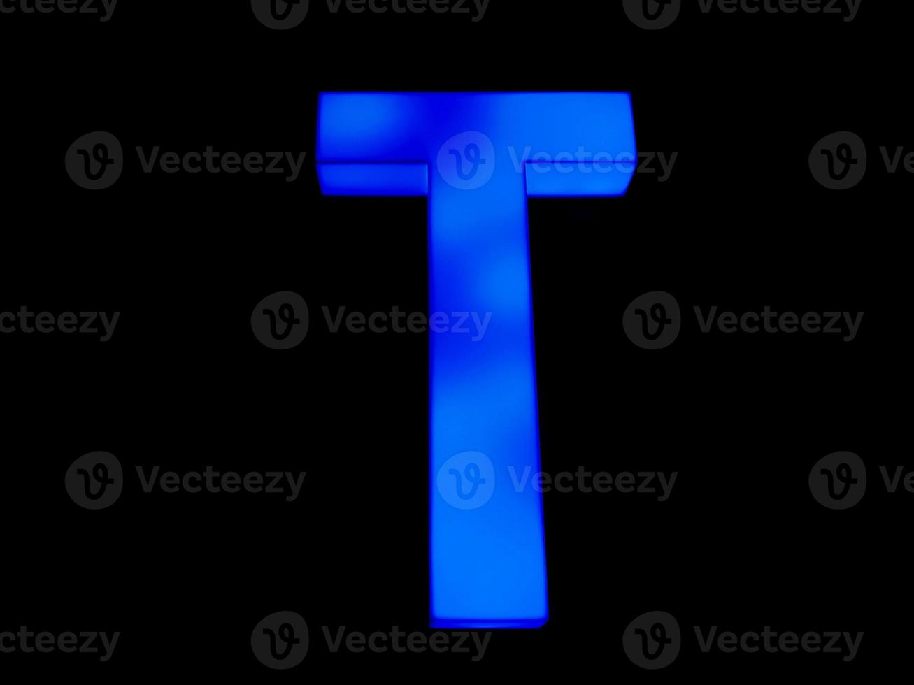 Blue neon letter T photo