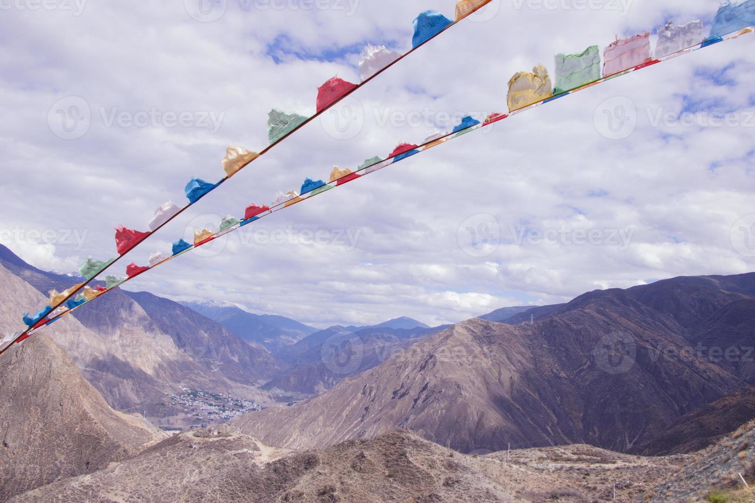 Rock mountain prayer flag landscape in Shangri La Yunnan China photo