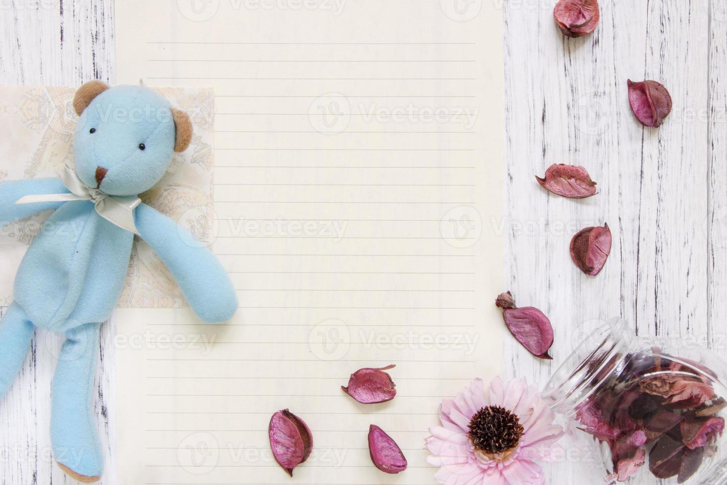 Paper with petals and toy photo