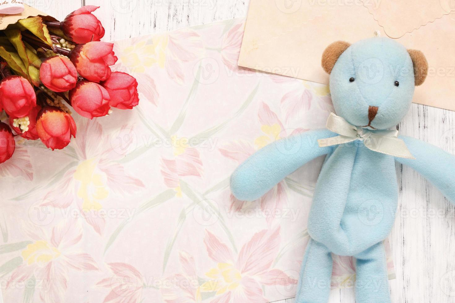 Floral paper with flowers and a toy photo
