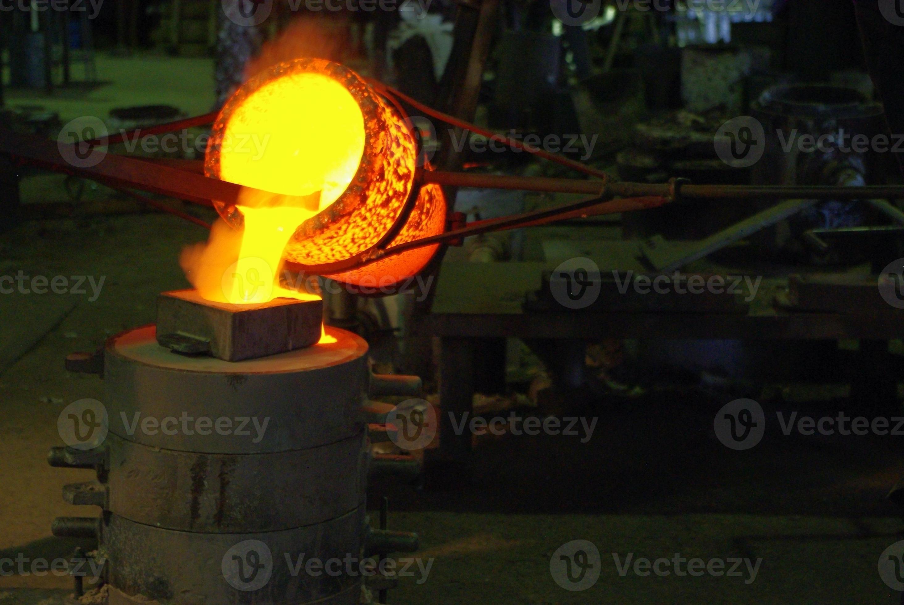 Molten metal pouring from crucible into box mould 3379331 Stock Photo