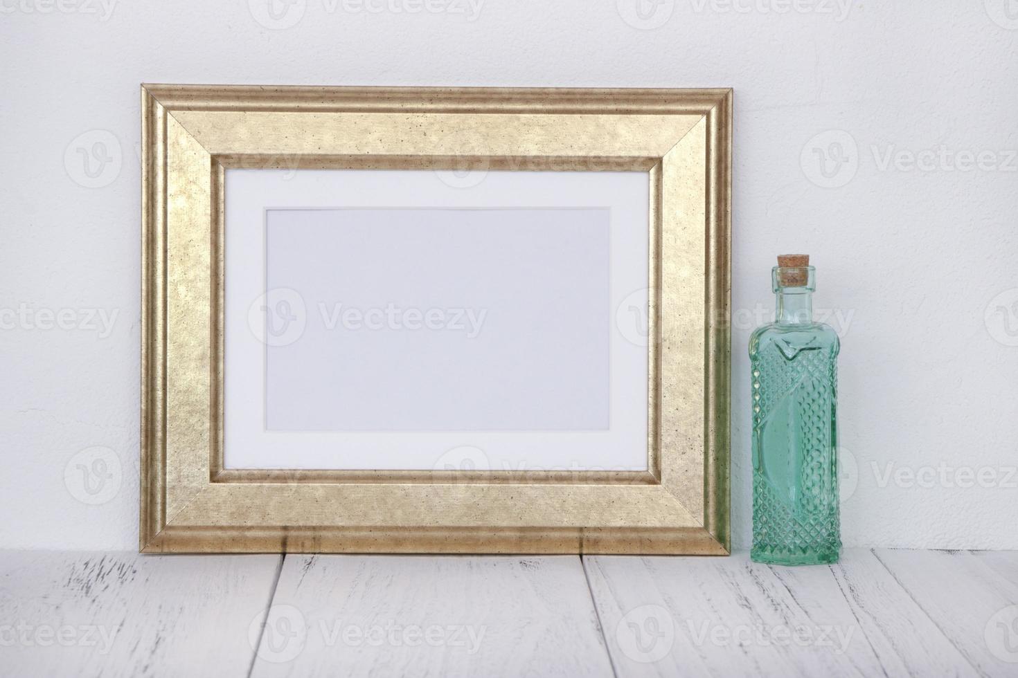 Gold frame with bottle photo