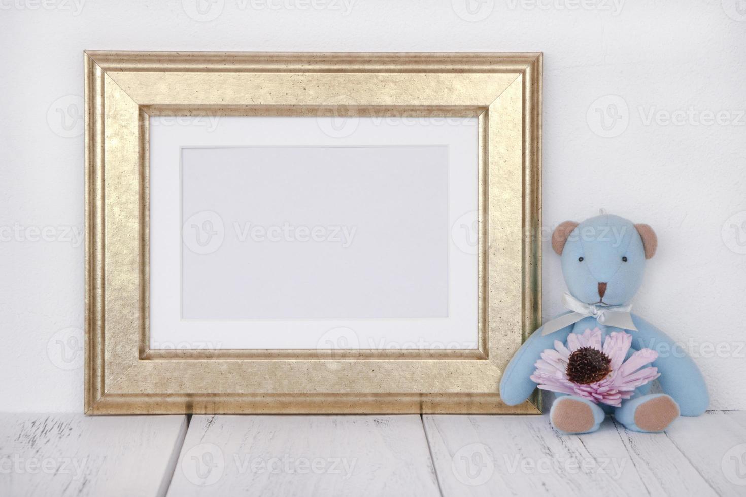 Golden frame with bear and flower photo