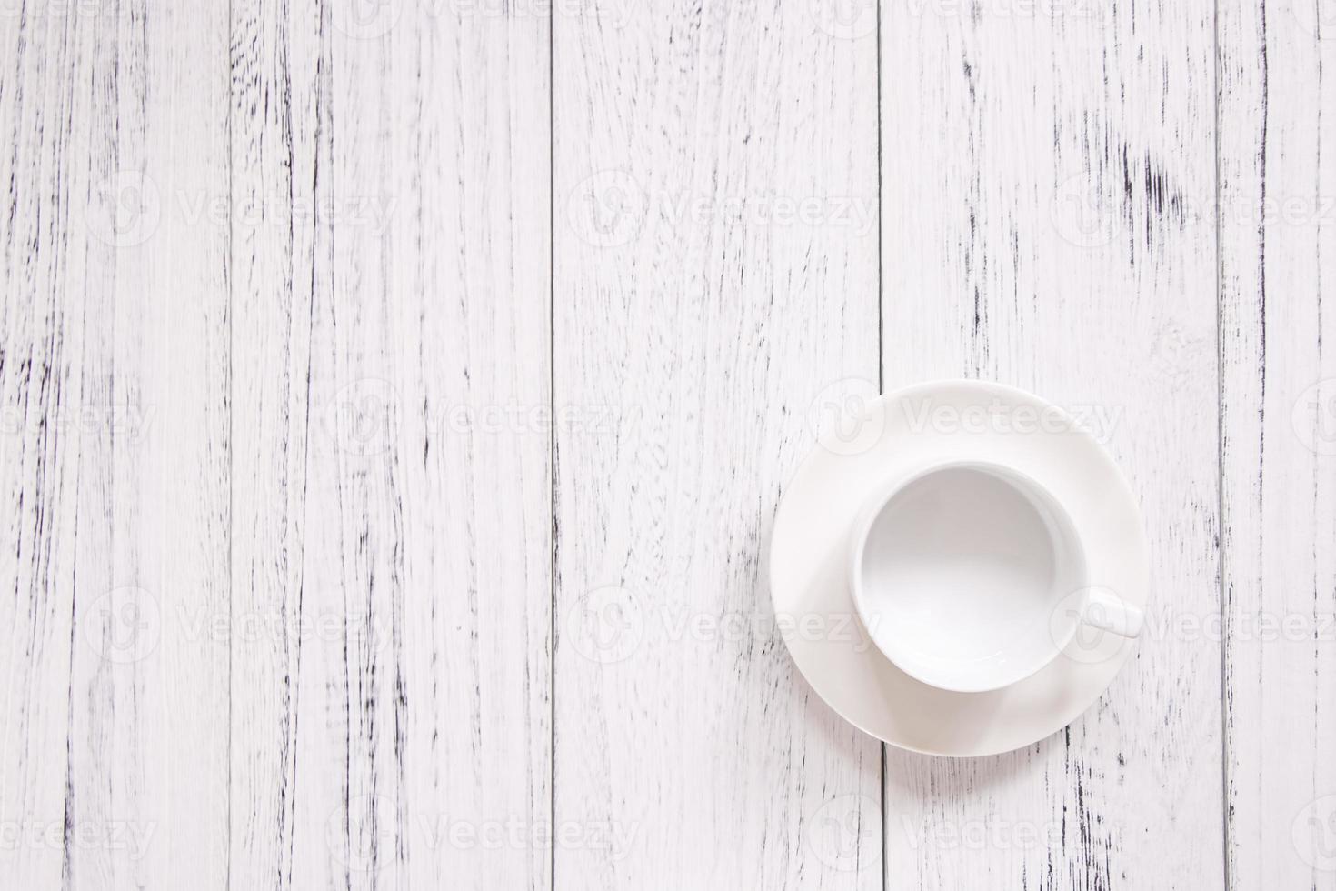 Coffee cup on white wood photo