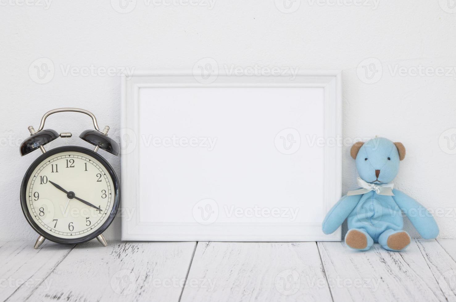 White frame with clock and bear photo