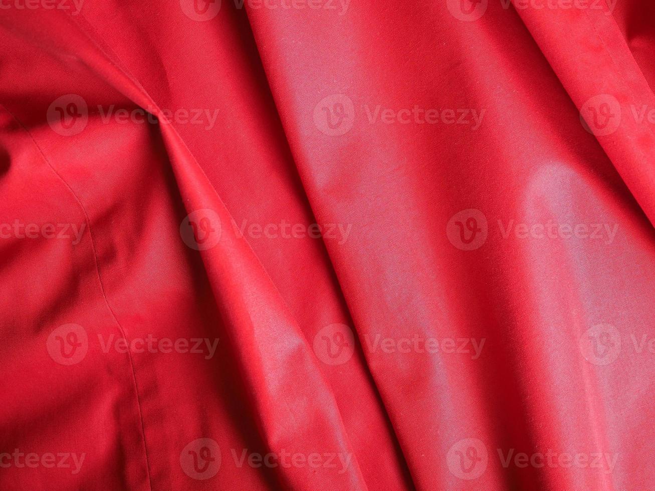 Rippled red polyester fabric texture background photo