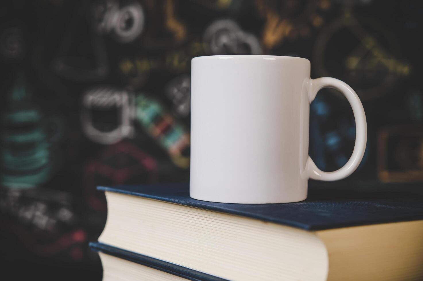 cup on the books in classroom photo