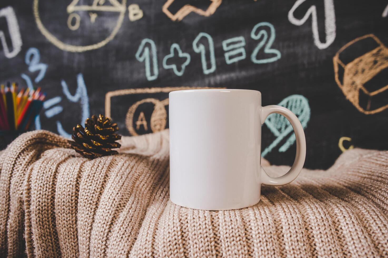 cup on the sweater in classroom photo