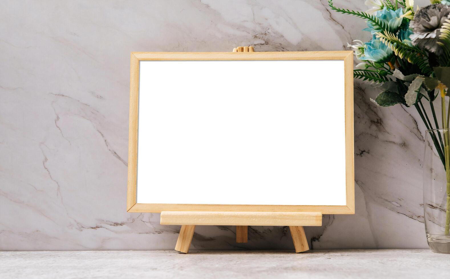 The picture frame is placed on the cement table. photo