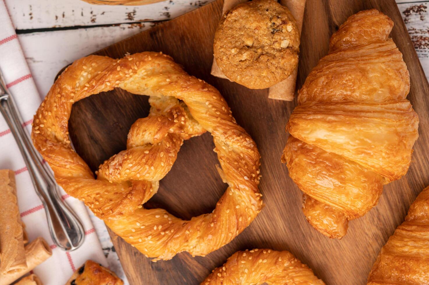 Various breads on red white cloth. Top view. photo