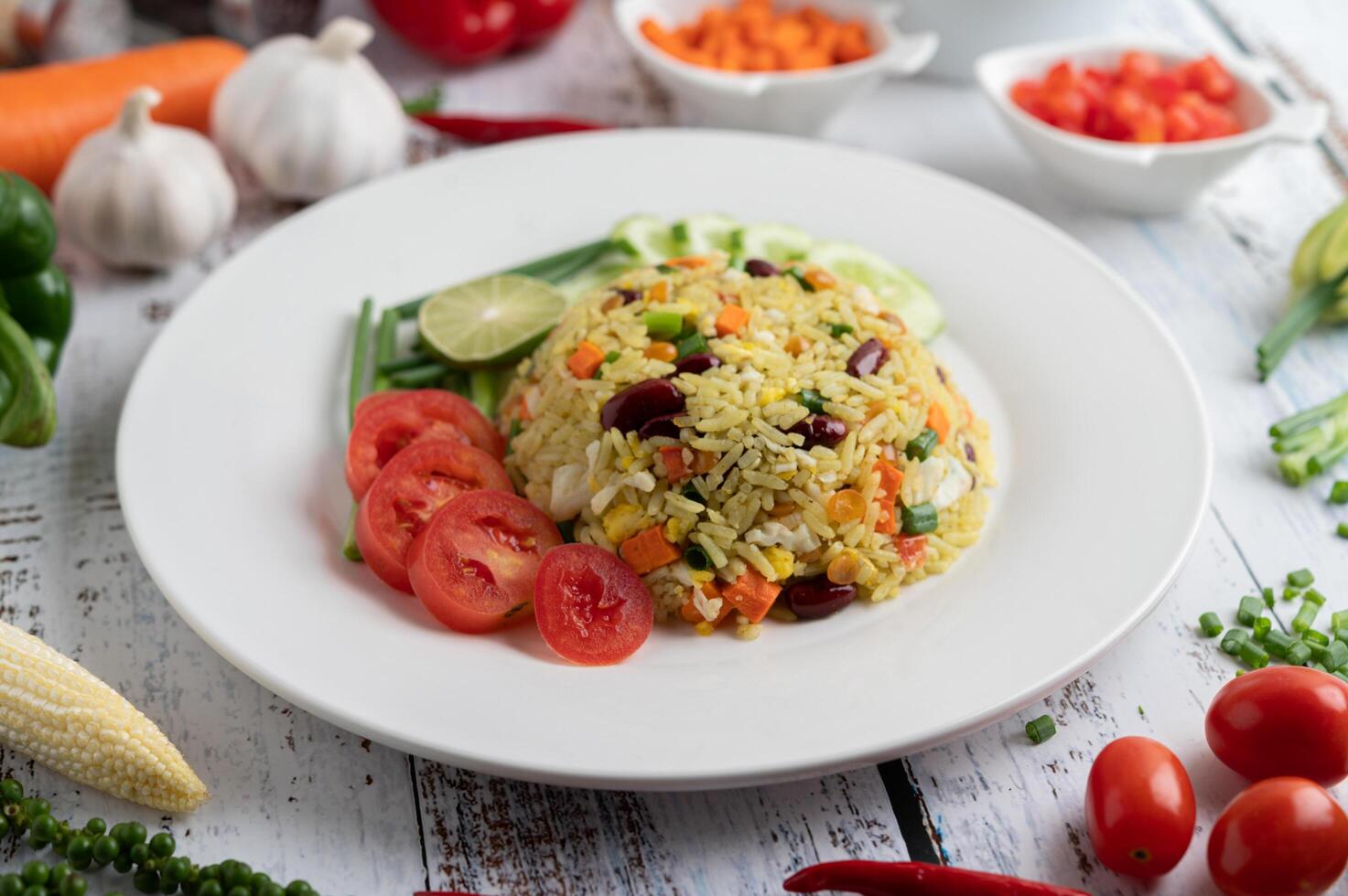 Fried rice in a plate on a white wooden floor photo