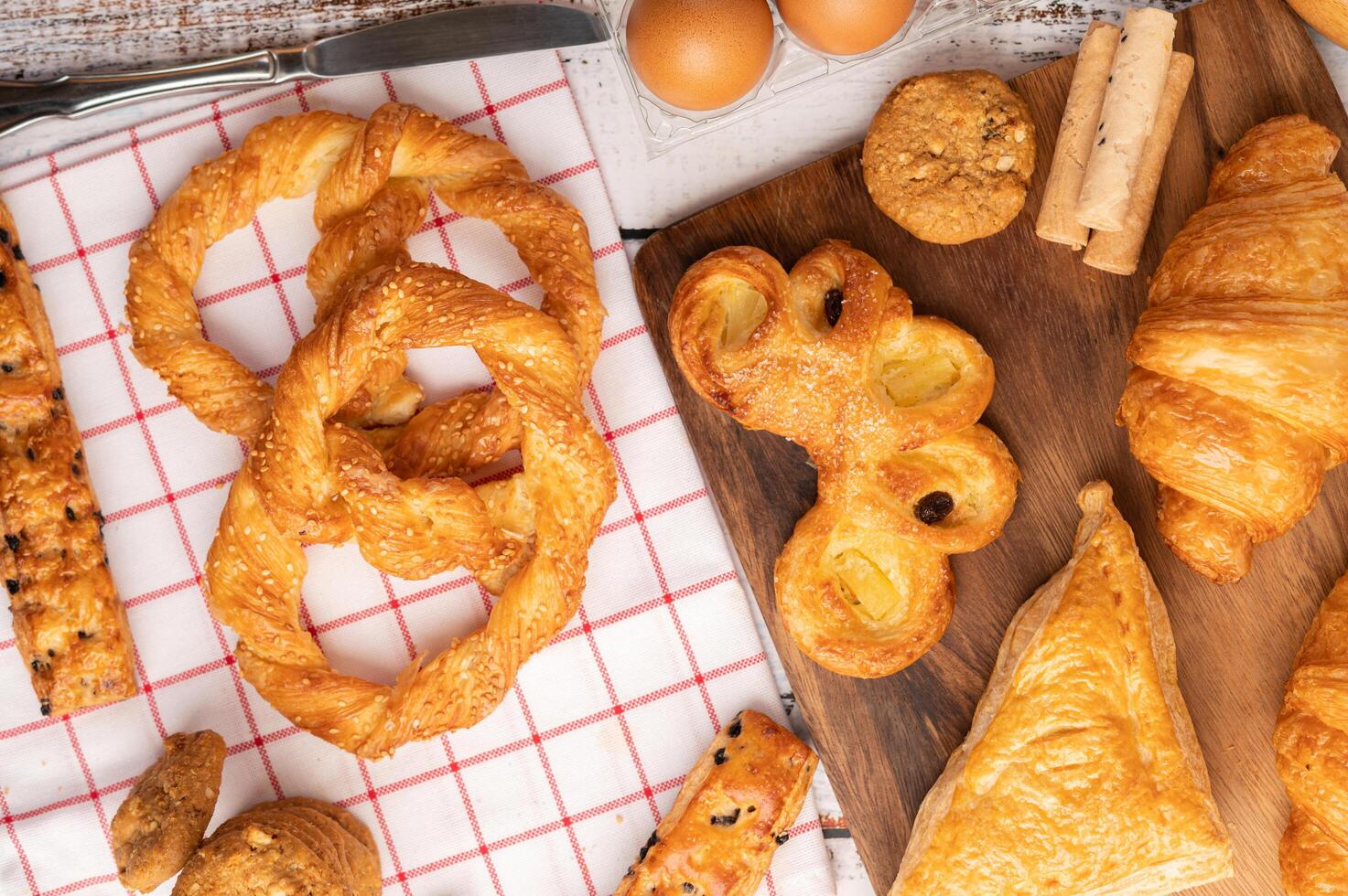 Various breads on red white cloth. Top view. photo