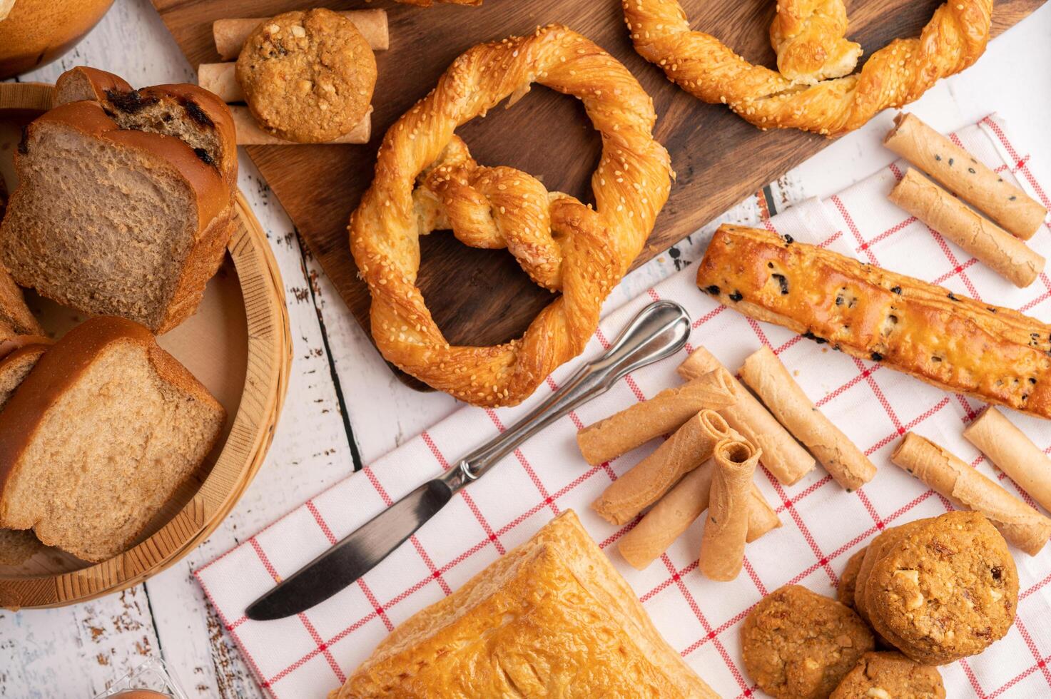 Various breads on red white cloth. Top view. photo