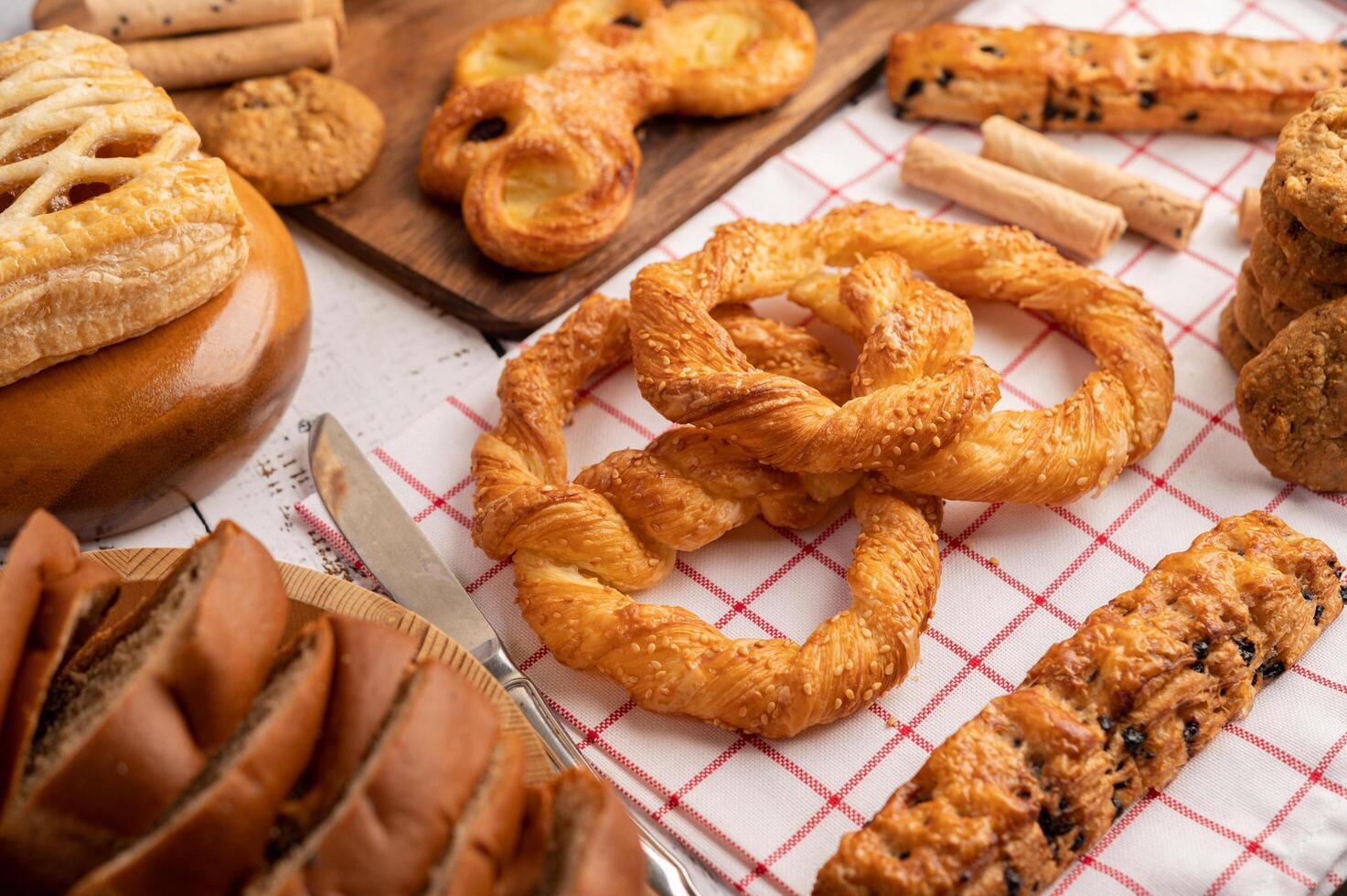 Various breads on red white cloth. Selective focus. photo