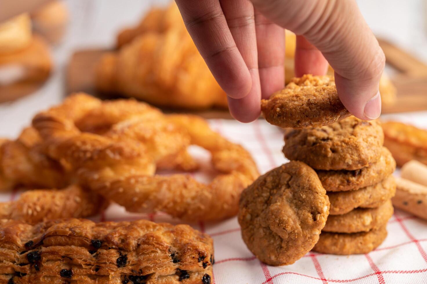 Cookies stacked on a white-red cloth. Selective focus. photo