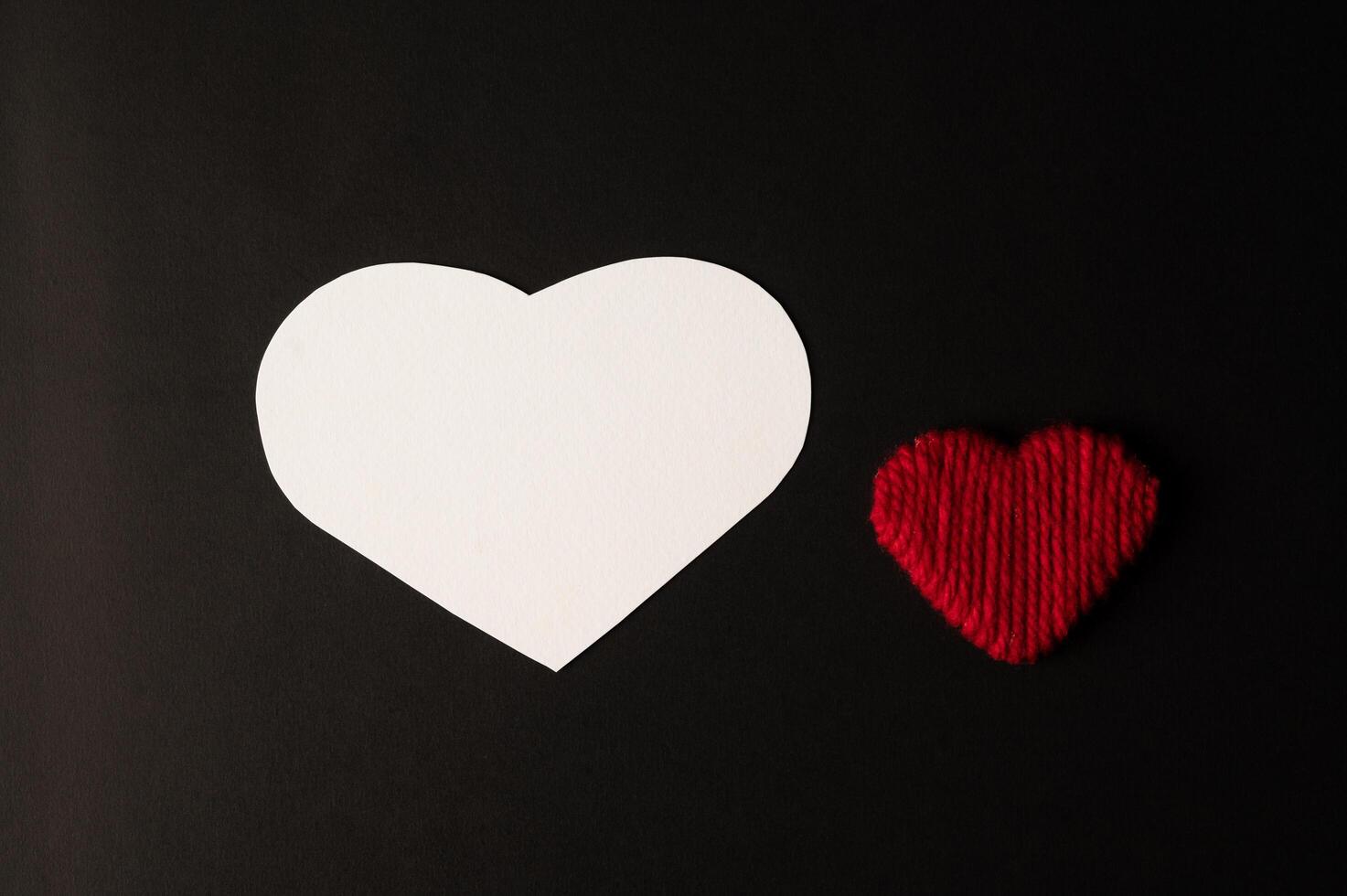 White hearts and red hearts made of paper are placed photo