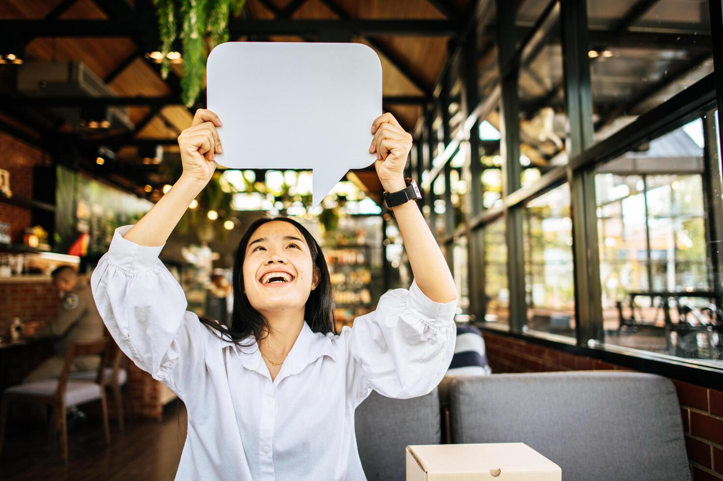 woman holding speech bubble rectangle with conners rounded photo