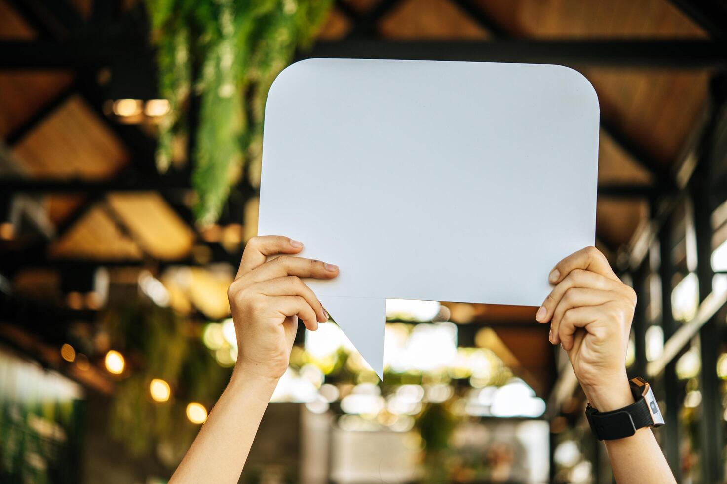 woman holding speech bubble rectangle with conners rounded photo