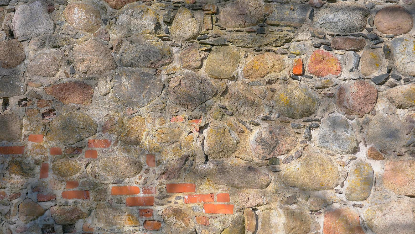 Fondo de textura de pared de ladrillo de piedra en el castillo de Trakai, Lituania foto