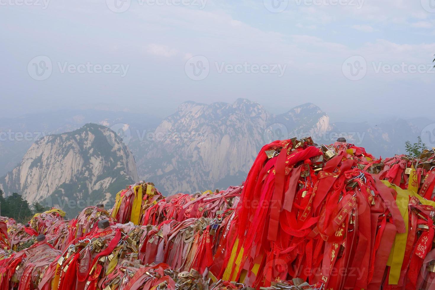 Red blessing cloth on the Sacred Taoist mountain Mount Huashan, China photo