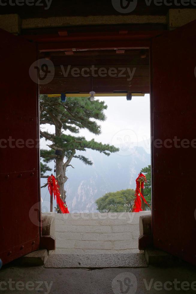 landscape view of Mount Huashan from a old ancient temple door photo