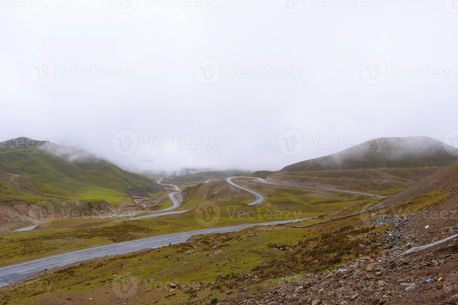 Road around the mountain cloudy day in Qinghai Province China photo