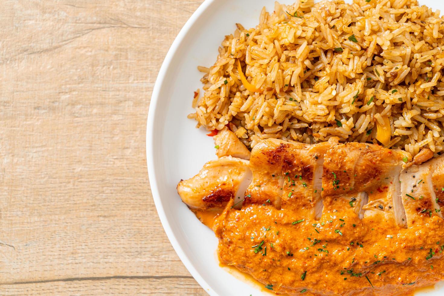 Grilled chicken steak with red curry sauce and rice photo