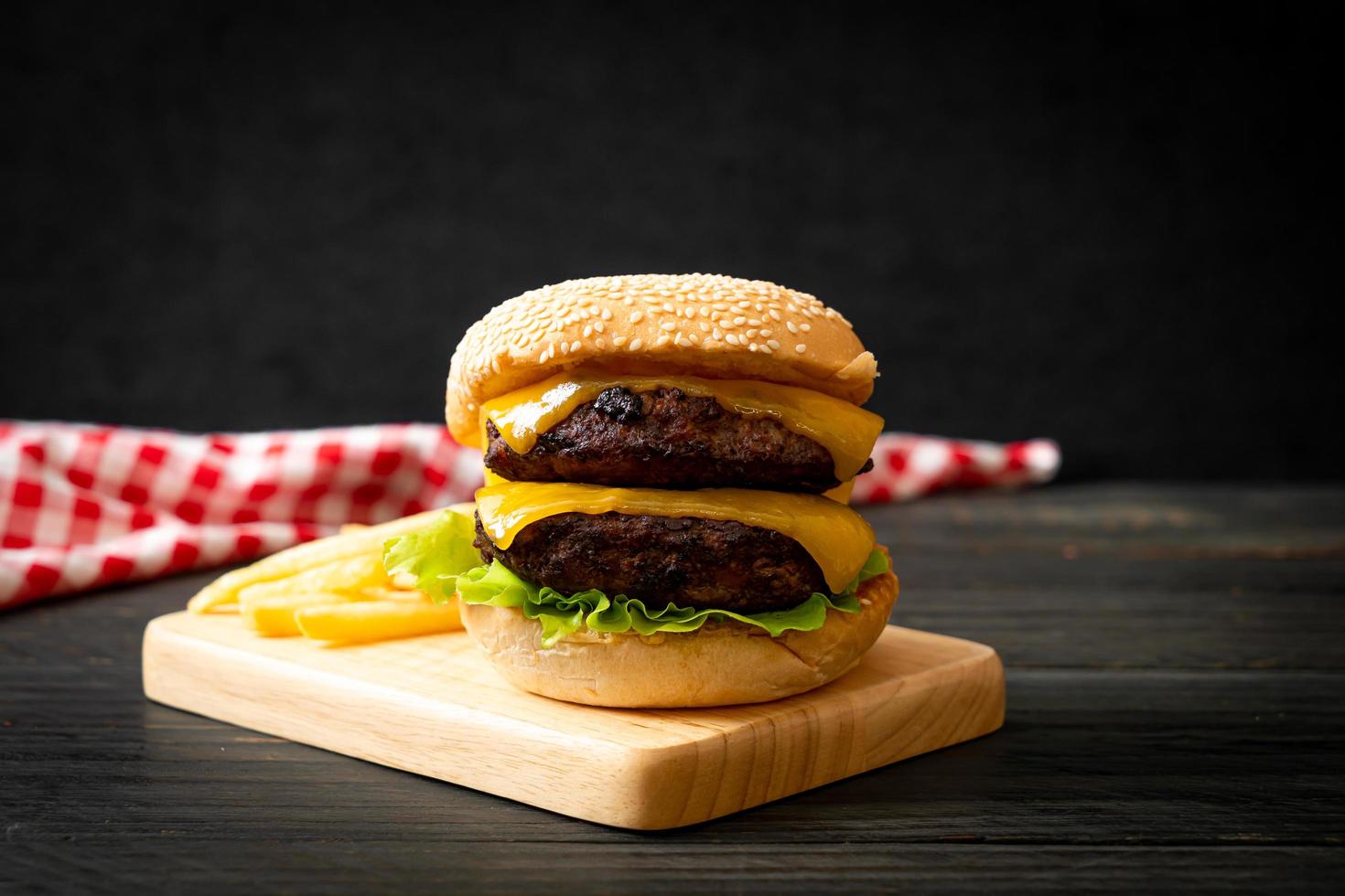 Hamburger or beef burgers with cheese and french fries photo