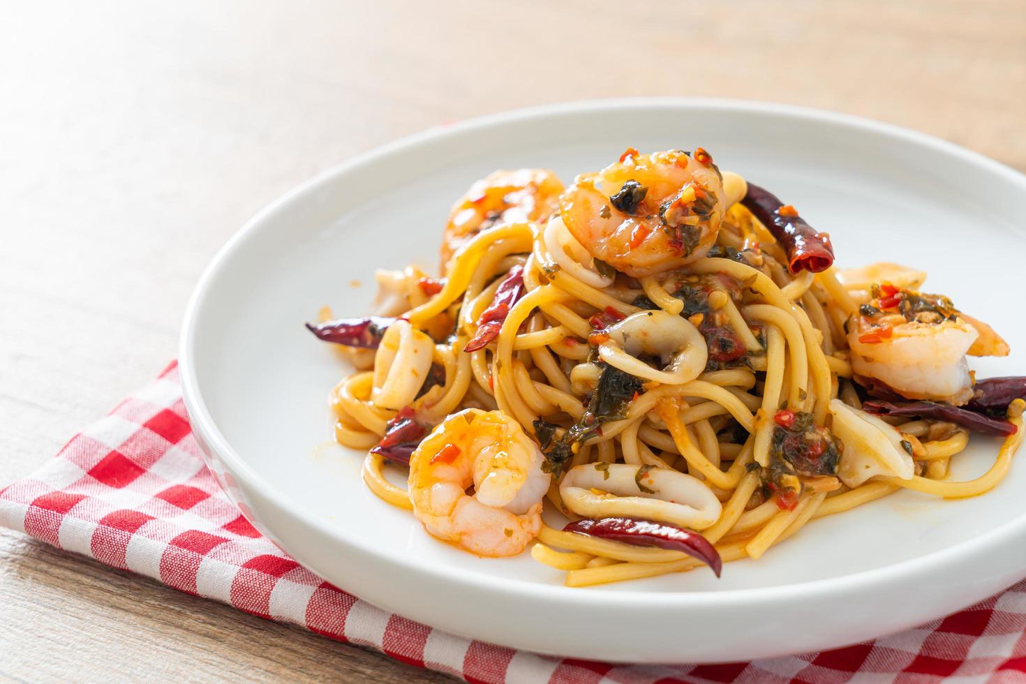 Spicy spaghetti seafood on plate photo