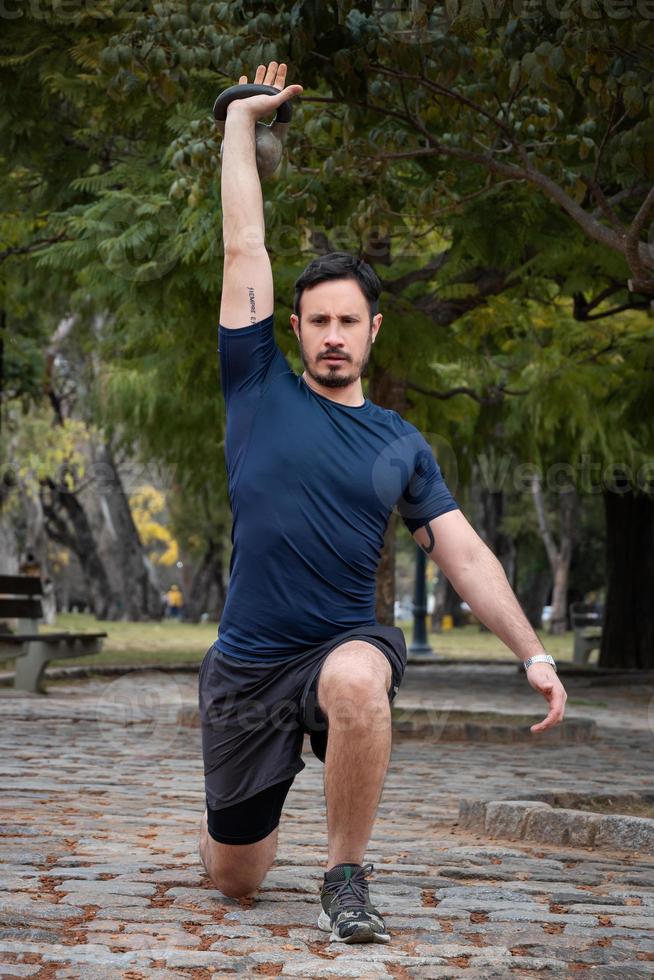 A man athlete doing a workout on the street in the morning photo