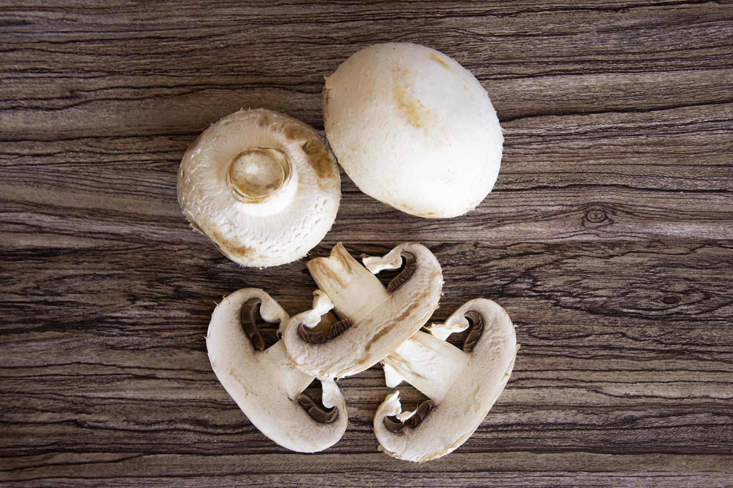 Champignons whole and slices close-up photo