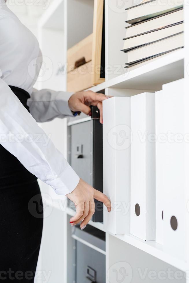 Portrait of young female lawyer working with documents photo